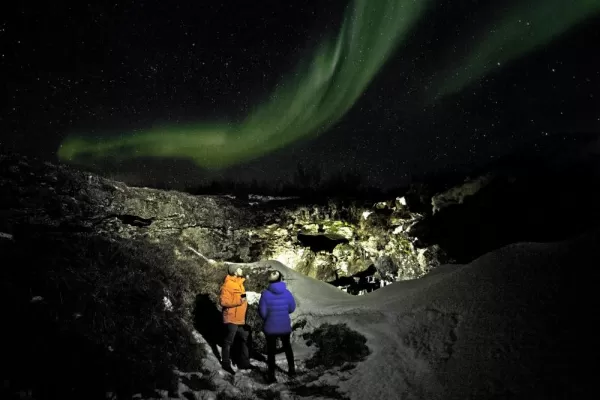 Travelers admire the Northern Lights