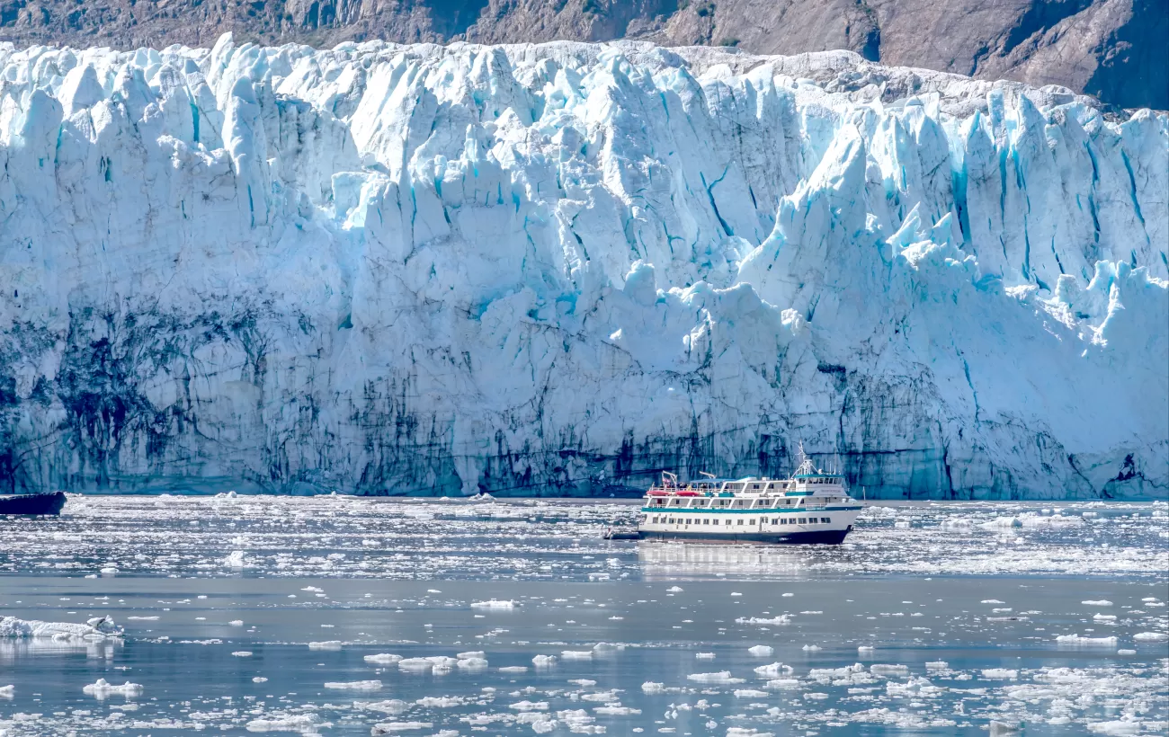 A small ship gets close to the glacier for a better look