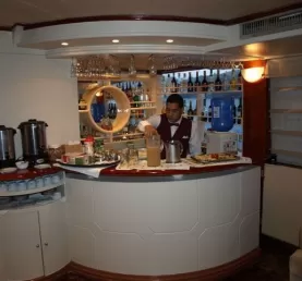 Wait staff clean and prepare for guests at the bar