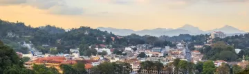 Soft evening light glows over Kandy City