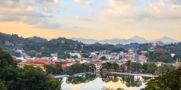 Soft evening light glows over Kandy City