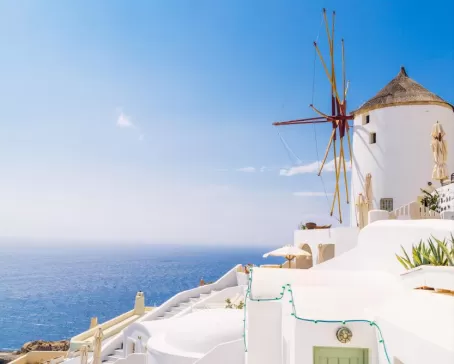 Admire the iconic whitewashed architecture of Santorini