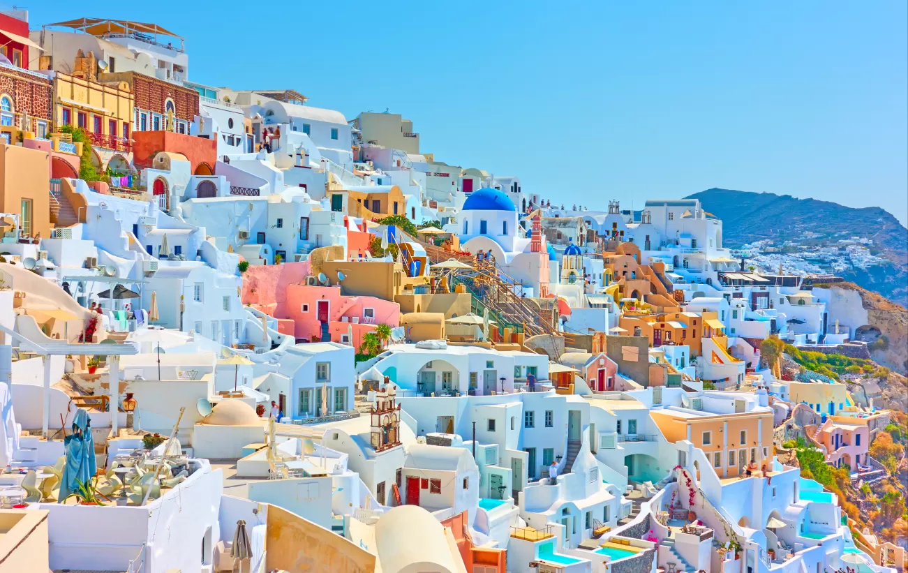 Wander through the maze of colorful buildings on Santorini