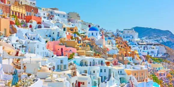 Wander through the maze of colorful buildings on Santorini