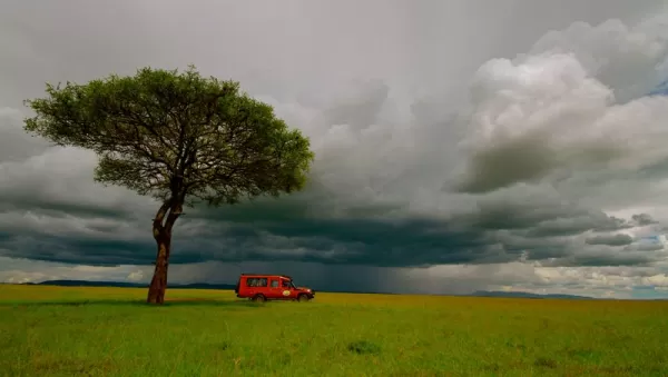 A safari vehicle waits for passengers in the Masai Mara