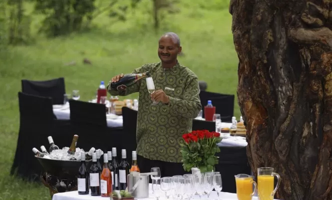 Friendly staff preparing sundowners