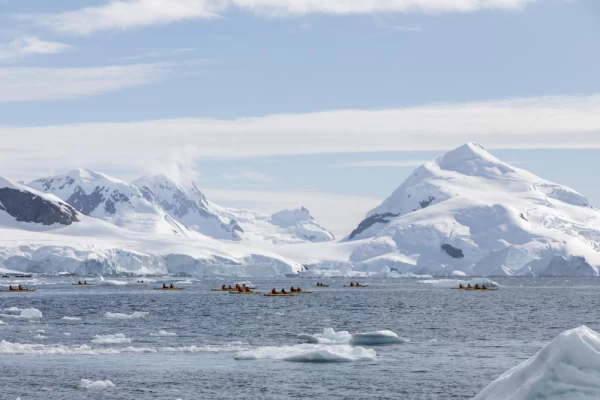 Kayaking through icebergs in Antarctica
