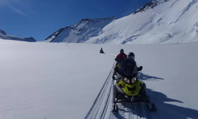 Snowmobiling near Three Glaciers Retreat. Courtesy Scott Webster, Antarctic Logistics & Expeditions