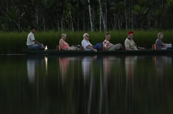 Explore the Amazon around Sacha Lodge in a traditional dug out canoe