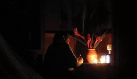 Journaling by candle light at Selva Bananito
