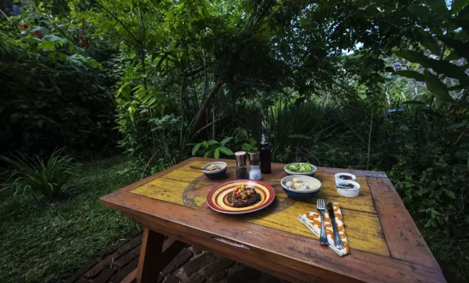Enjoy a meal in Zomba Forest Lodge's beautiful gardens