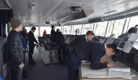 In the bridge, watching the captain and crew navigate L'Austral through ice fields.