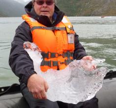 Chris with a hunk of iceberg soon to be ice cubes