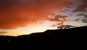 The sun sets over the domes