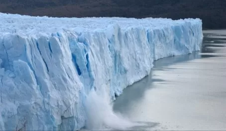 Piece of ice collapses as the glacier advances