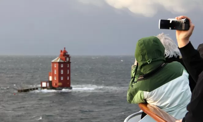 Everybody wants to take pictures of Kjerungskjær Lighthouse. On board MS Polarlys