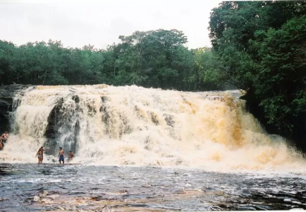 Enjoy the mist of a cascading waterfall in the Amazon