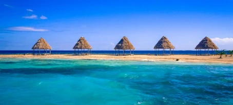 A row of palapas on Belize Barrier Reef