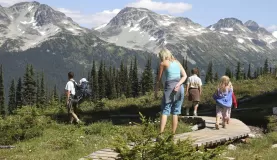 Family hiking on a tour of Alaska