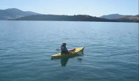 Trip Coordinator, Mary, takes out a kayak