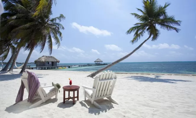 Relax on acres of private white sand beaches at Victoria House
