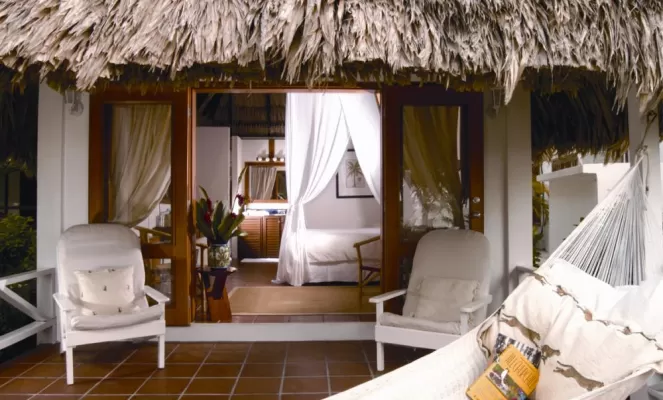 Peek inside one of Victoria House's thatch-roofed Casitas 