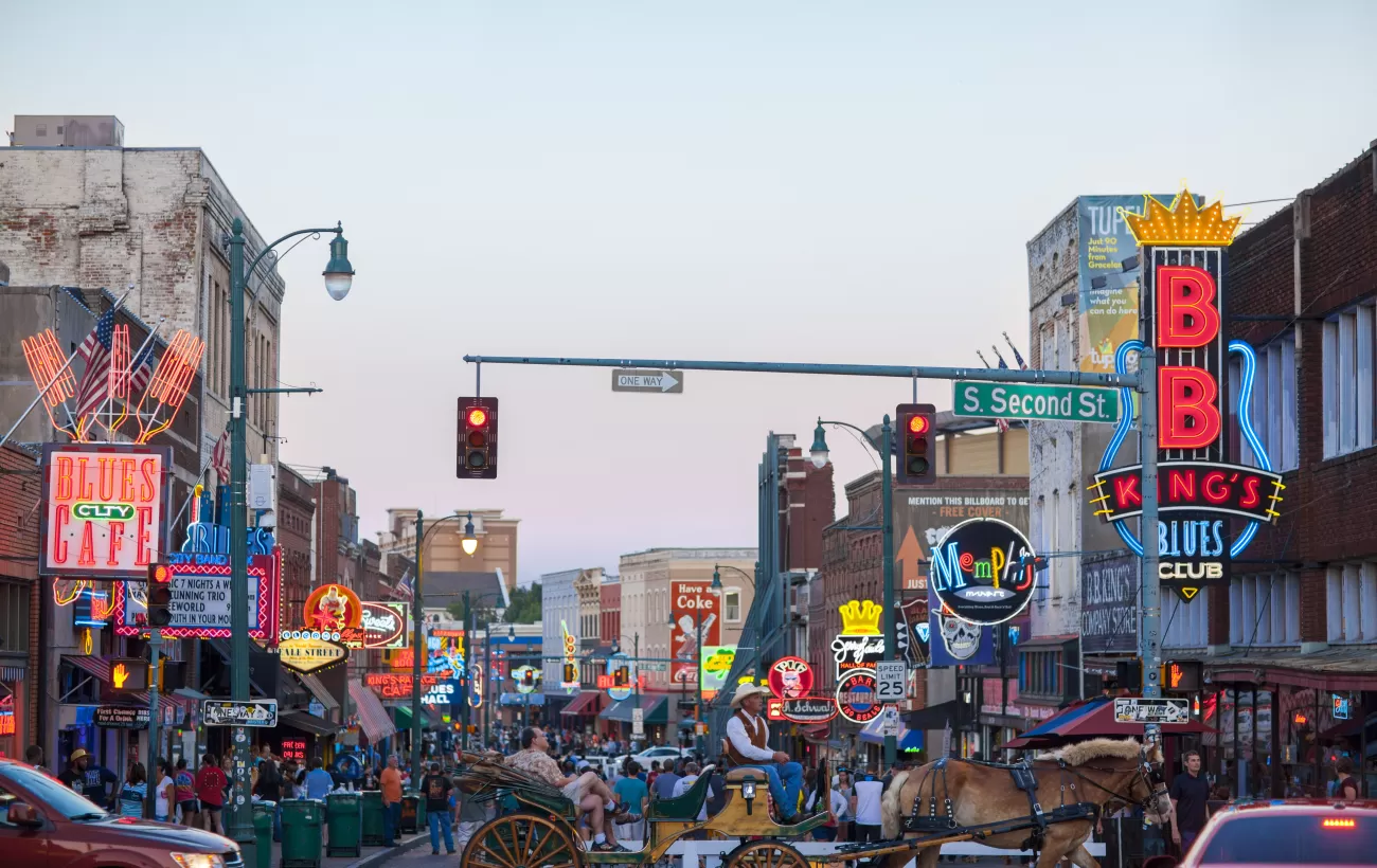 View of a crowd of tourists enjoying the music clubs and retail establishments that line the famous music district of Beale Street in downtown Memphis