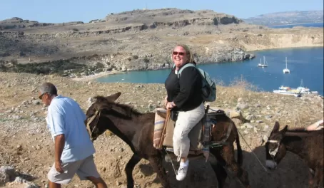 Riding burros in Greece.