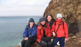 Happy travelers on the top of Neptune\'s Window.