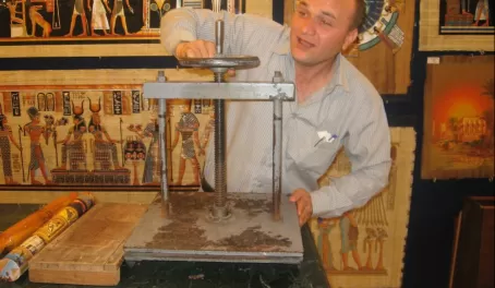A man doing a demonstration of how to make papyrus