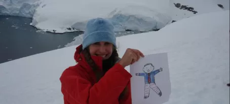 Beth and Flat Stanley at Paradise Bay in Antarctica