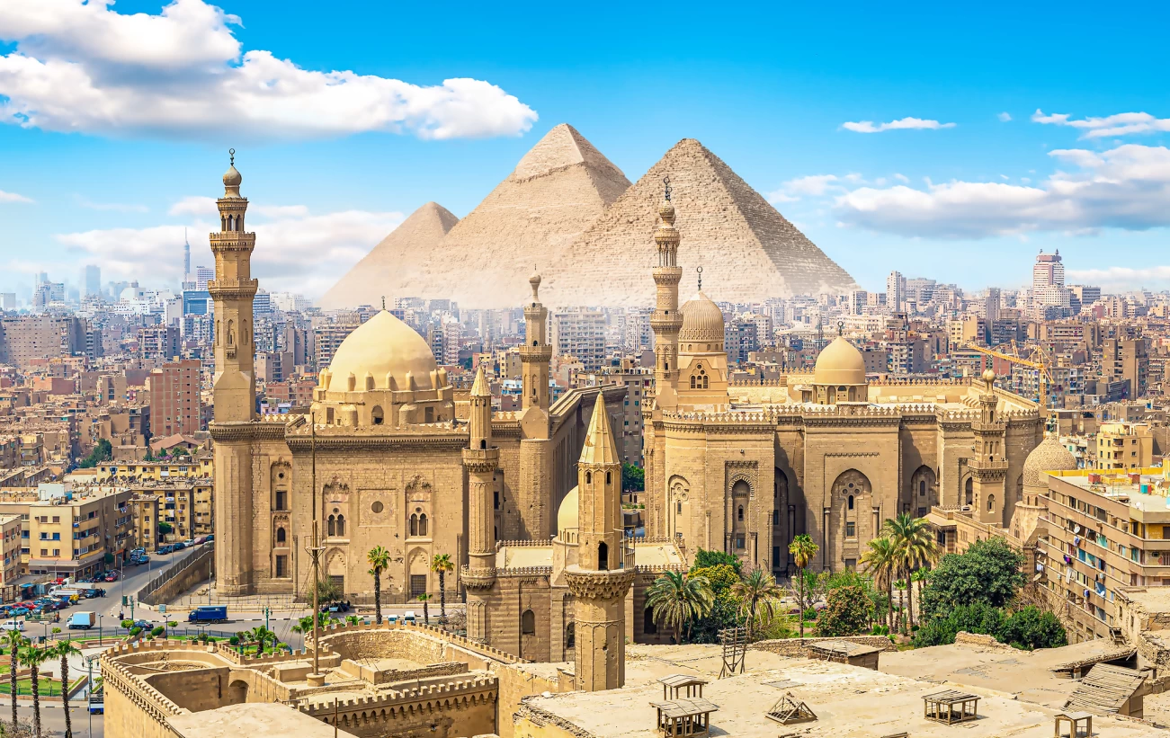 View of the Mosque Sultan Hassan in Cairo and pyramids
