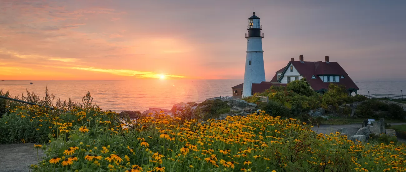 Colorful sunrise at Portland Head Lighthouse in Maine