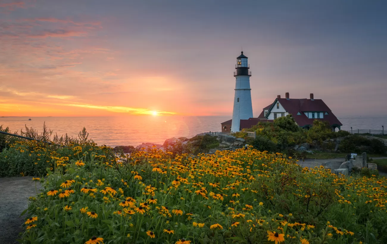 Colorful sunrise at Portland Head Lighthouse in Maine