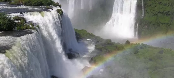 Beautiful rainbow in the mist of Iguazu Falls