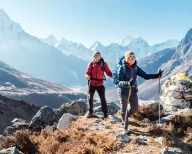 Couple following Everest Base Camp trekking route near Dughla 4620m