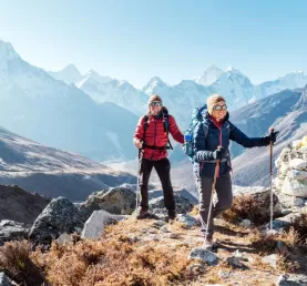 Couple following Everest Base Camp trekking route near Dughla 4620m