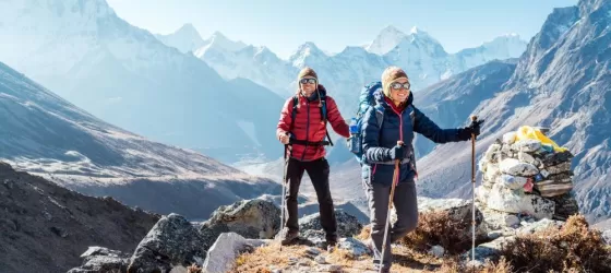 Couple following Everest Base Camp trekking route near Dughla 4620m