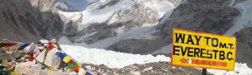 Signpost way to Mount Everest B.C., Khumbu glacier and prayer flags, Nepal