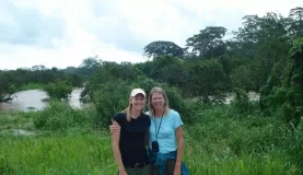 Mom and I with the flood behind us