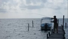 Joe fishes in Belize