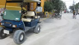 Golf cart - No vehicles are allowed on Caye Caulker.  Golf carts are like taxis here.