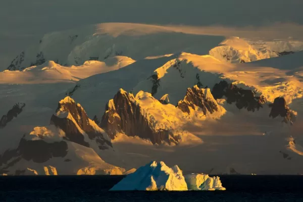 Iceberg extraordinary form at sunset in backlight rays of the sun in Antarctica. The beauty of Antarctica