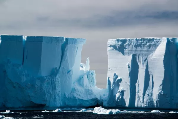 Raking light on a blue white floating tabular iceberg in the Weddell Sea
