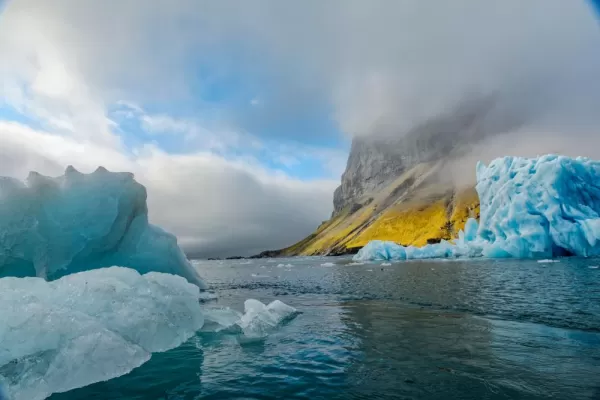 Iceberg adrift in the ocean, Svalbard, Norway.