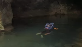 Swimming in to the entrance of the ATM cave