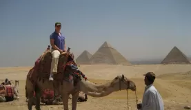 Take a camel ride around the pyramids.