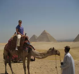 Take a camel ride around the pyramids.
