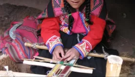 Girl weaving textiles