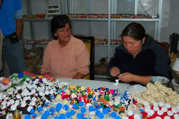 Locals making masapan figurines in Calderon